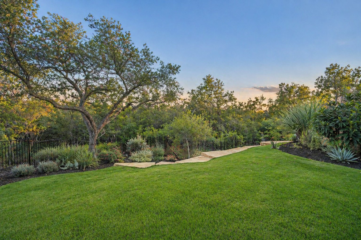 Landscaped lawn and protected greenbelt behind 4300 Amarra Drive