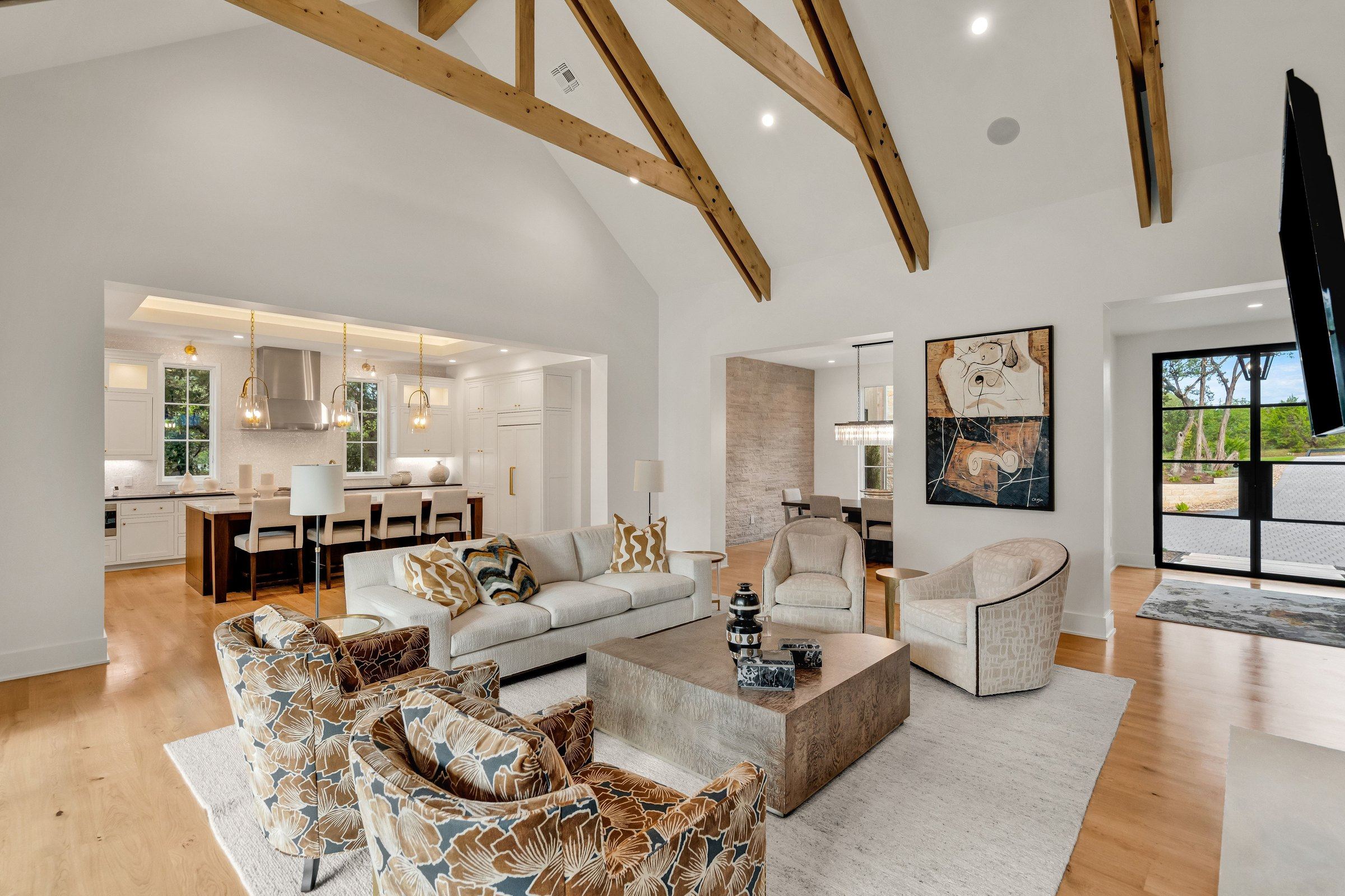 Wide view of the living room, kitchen, and dining spaces at 4300 Amarra Drive