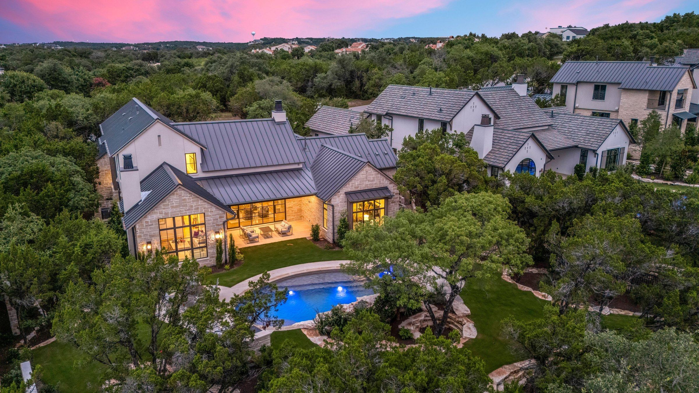Aerial twilight view of 4300 Amarra with pool in Amarra Cottages, Barton Creek