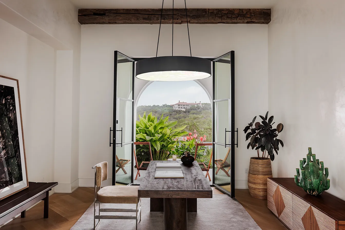 Interior sitting room with open doors to an Amarra view